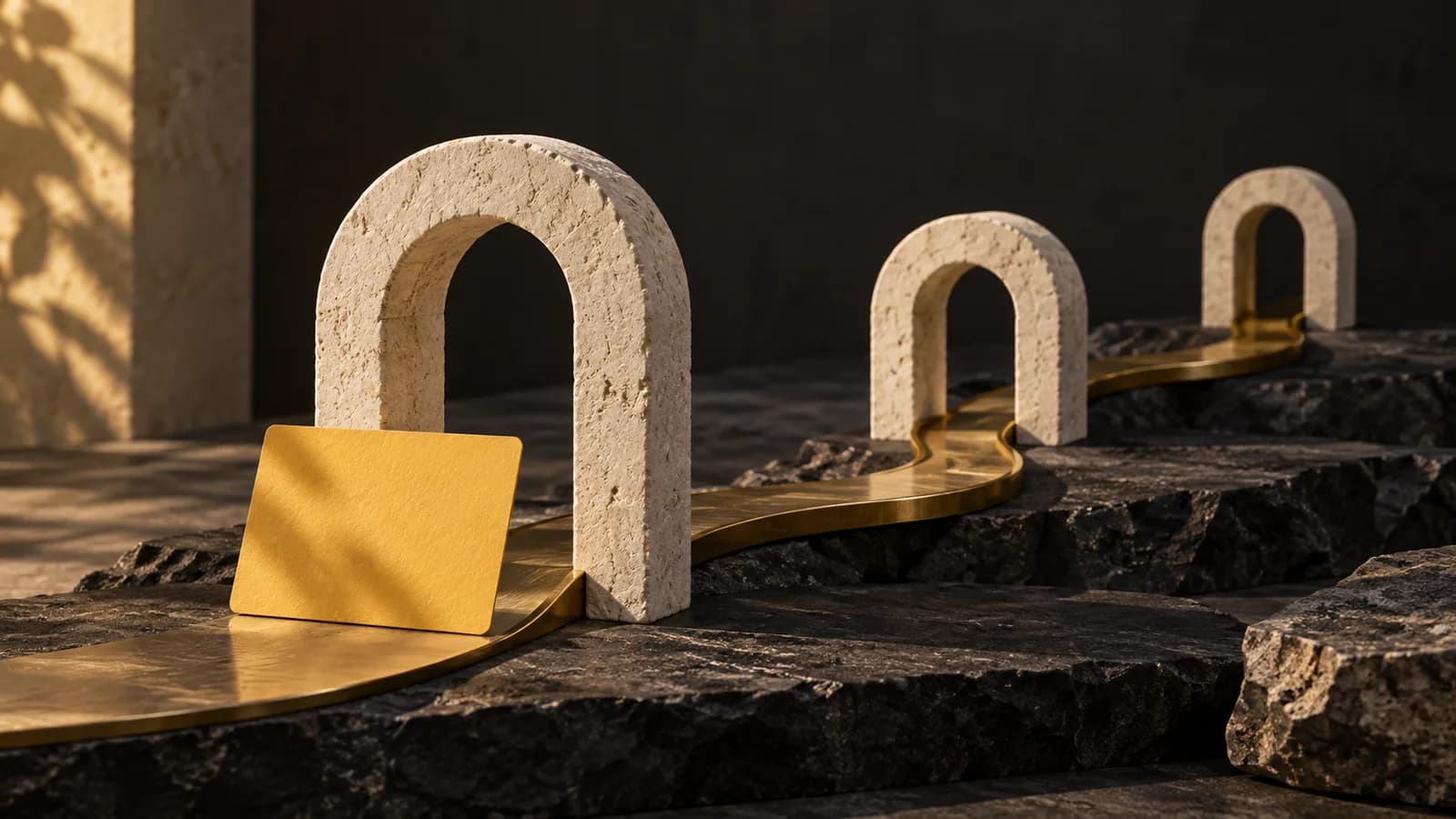 Cream stone archways connected by a brass path, with a yellow invitation card at the entrance.